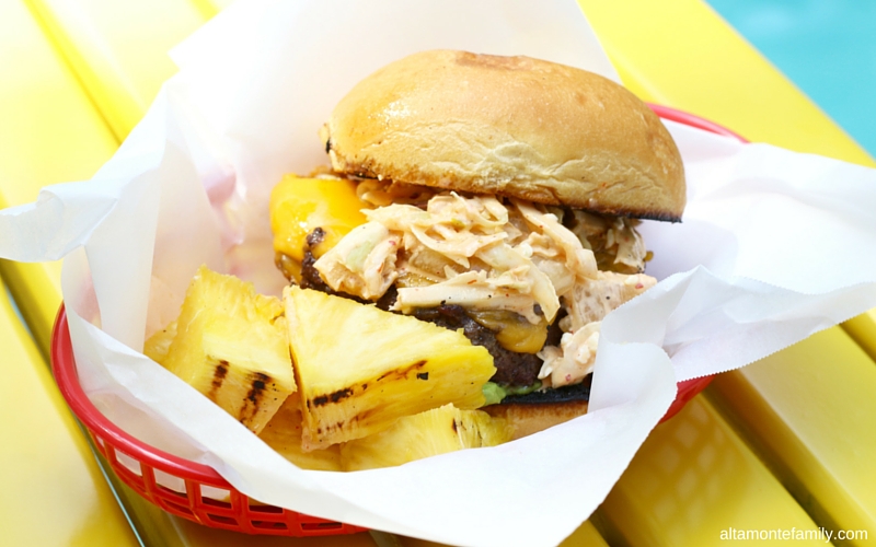 Grilled hamburger with kimchi slaw and pineapples